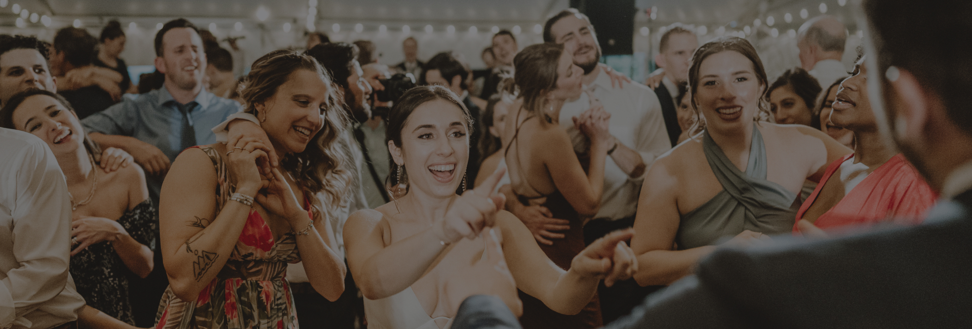 wedding guests dancing and celebrating